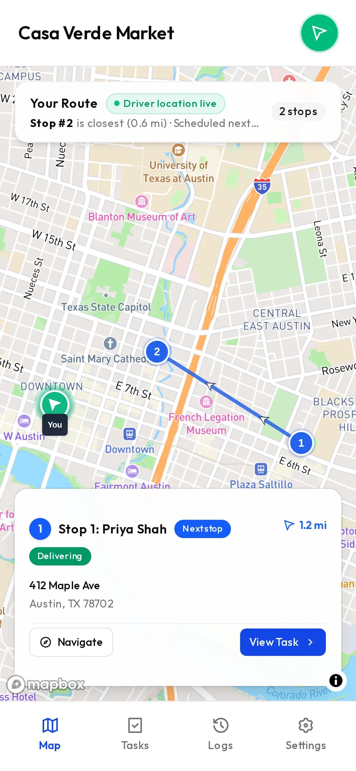 The driver app showing the next stop, distance, and a navigate button